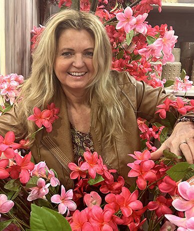 Nance with her premium silk flower collection